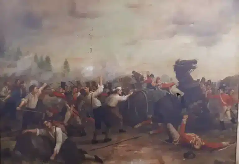 Painting of the Battle of Three Rocks showing Irish rebels clashing with British troops amid smoke, fallen soldiers, and a rearing horse on the chaotic battlefield.