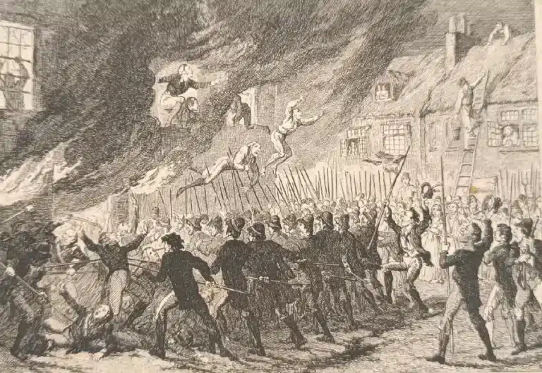 Picture depicting a scene from the 1798 Rebellion, showing a burning building with people leaping from the flames as armed rebels gather below with pikes in a chaotic crowd, featured at the National 1798 Rebellion Centre, Enniscorthy.