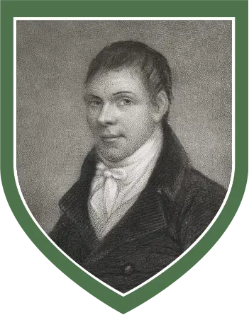 Black and white portrait of a young man, Michael Dwyer, with short hair wearing a high-collared shirt and dark coat, framed within a green shield border, featured at the National 1798 Rebellion Centre, Enniscorthy.