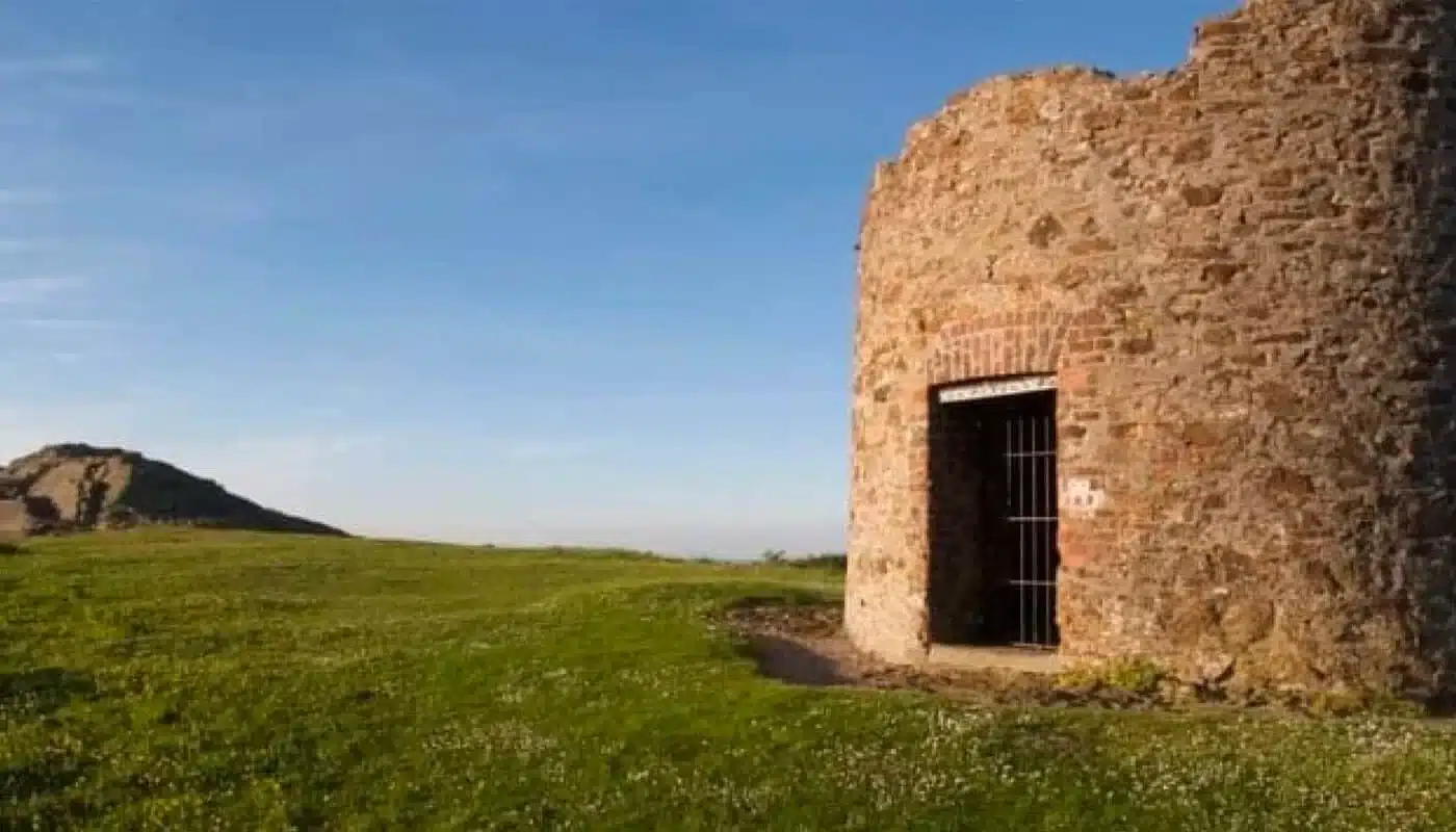 Ruin of stone watchtower on Vinegar Hill overlooking the surrounding Wexford countryside, at sunset.